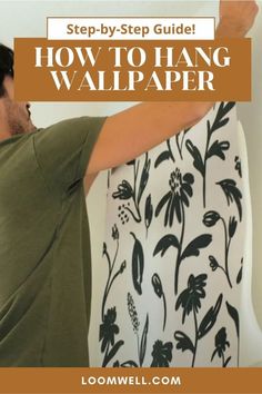 a man is painting the wall with flowers on it and text overlay reads, step - by - step guide how to hang wallpaper