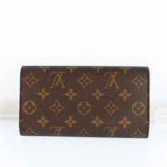 Introducing the Louis Vuitton Porte Tresor International Long Wallet, a sophisticated accessory for the modern fashionista. Crafted from iconic Monogram canvas, this wallet exudes luxury and style. Its spacious interior features multiple card slots, a zipped coin pocket, and ample space for bills, making it both practical and chic.The elegant design of the Porte Tresor wallet is accentuated by its gold-tone hardware and signature LV snap closure. Perfect for everyday use or special occasions, this wallet effortlessly combines fashion and functionality. Elevate your accessory game with this timeless piece from Louis Vuitton.Whether you're running errands or attending a soirée, the Louis Vuitton Porte Tresor International Long Wallet is the perfect companion. Treat yourself to this exquisite Fendi Bags, Prada Bag, Long Wallet, Monogram Canvas, Dior Bag, Chanel Bag, Gucci Bag, Timeless Pieces, Running Errands