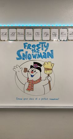 a frosty the snowman poster hanging on a wall