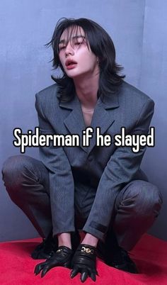 a man in a suit sitting on top of a red carpet with the words spiderman if he slayed