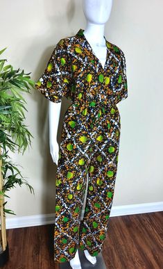 African print batik jumpsuit, Women summer batik jumpsuit, Wide leg jumpsuit  Our African print batik jumpsuit is a beautiful piece for any fashion-forward woman. This beautiful jumpsuit is a balance of elegance and comfort at every step. A wide leg piece that is suitable for the hot summer days and calm fall weather. Featuring a V-neckline, two side pockets and a zipper closure. Dress up or you dress casual and you will feel more than just stylish! Care instructions: no bleaching, wash with likes colors on a gentle circle, dry on low to medium heat.  Let us introduce you to our colorful world of beautiful African print fabric! Their unique patterns and vibrant colors help you feel instantly happier, which is why we love using them to make Afrocentric clothing.  These versatile fabric can Afrocentric Clothing, Jumpsuit Wide Leg, Beautiful Jumpsuits, African Print Fabric, Fall Weather, Wide Leg Jumpsuit, African Print, Hot Summer, Chia