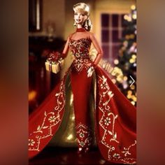 a barbie doll dressed in red and gold