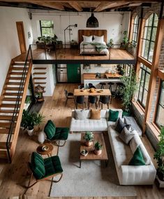 a living room filled with lots of furniture next to a loft style house type building