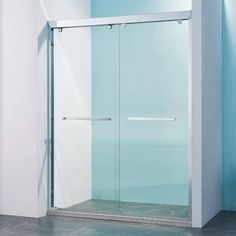 a glass shower door in a bathroom with blue walls and tile flooring on the side