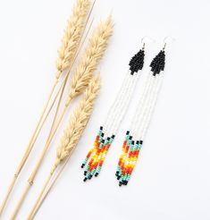 These boho earrings are made using traditional freehand beading techniques. Earrings are made of quality Czech beads and strong thread. 925 silver hooks or 925 silver leverbacks. Earrings are 13.5 cm ( 5.3 inches)  length with hooks and 1 cm ( 0.4 inches) width. Colors: black,white,blue,green,red,orange,yellow. Perfect for any occasions. 100% handmade. See more of long size earrings here: https://www.etsy.com/shop/SandasHandmades?ref=seller-platform-mcnav&section_id=40275381 See the rest of shop White Handwoven Earrings For Summer, Handwoven Dangle Earrings For Summer, Handwoven Artisan Jewelry For Summer, Artisan Handwoven Jewelry For Summer, Traditional Summer Beaded Jewelry, Traditional Multicolor Summer Jewelry, Bohemian Earrings With Tiny Beads For Summer, Artisan Earrings With Colorful Beads For Summer, White Bohemian Beaded Earrings With Silver Beads