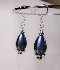 Beautiful purple glass pearl teardrop earrings Length: I inch drop To view more earrings in my shop, please click the link below: https://www.etsy.com/shop/CopperTulipDesigns?ref=seller-platform-mcnav&section_id=17212966 To view other items in my shop,  please click the link below:  https://www.etsy.com/shop/CopperTulipDesigns?ref=hdr_shop_menu Please read my shop policies before checking out.   Thank you for visiting my shop. Purple Drop Earrings, Pearl Teardrop Earrings, Purple Glass, Wedding Earrings, Teardrop Earrings, Shop Policies, Earring Gifts, Gift Item, Jewelry Earrings Dangle