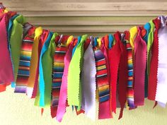 the colorful ribbons are hanging on the clothesline for decoration or to hang from the ceiling