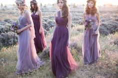 the bridesmaids are dressed in purple dresses