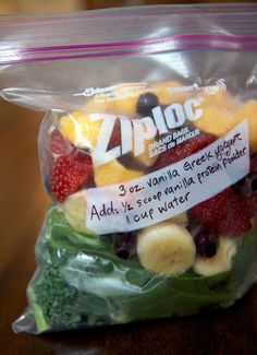 a bag filled with fruit and veggies sitting on top of a wooden table