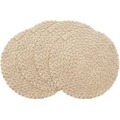 two round rugs on top of each other in various sizes and colors, one is beige