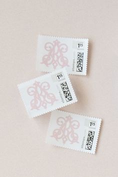 three postage stamps with the letters t and f on them are laying next to each other