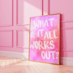 a pink wall with a framed poster that says what it all works out? on the floor