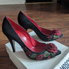 Presenting A Pair Of Gorgeous Retro 1950s Style Black Suede Pumps By Italian Designer Moschino From Their Cheap And Chic Line. The Pumps Are Embellished With A Beaded Knit Red Flower On The Toes And A Floral Beaded Leaf Motif On The Sides. The Colors Of The Beads Are Red, Green, Aurora Borealis Iridescent Blue. All Of The Beads Are Intact. These Would Be Perfect For A Glamorous Spring Party Or Formal Event. They Come In Their Original Box With The Dust Bag. They Have A Slightly Pointed Toe And A Sexy Low Cut Vamp. The Heels Are 4" Insoles L 9 1/2 " W 3" Green Aurora Borealis, Green Aurora, Moschino Shoes, Beaded Leaf, Moschino Cheap And Chic, Iridescent Blue, Black Suede Pumps, 1950s Style, Leaf Motif