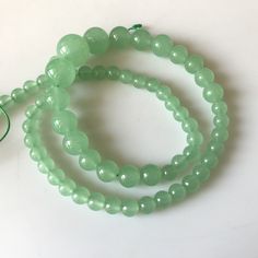 "6mm To 13mm Green Chrysoprase Color Jade Round Beads Green Jade Smooth Round Beads 18 Inch Strand Jade Necklace, Jade Jewelry GDS1793. Gemstone: Jade Size(mm): 6-13mm Length(inch): 18\", 65pcs Aprox Weight: 190gms Approx Color: Green (Color Treated) Item Code: GDS1793 (Weight, Measurements and number of pieces are approximate) You can get Authenticity Certificate at an extra cost of $15.00 We guarantee that the raw diamonds we offer are conflict-free--we only source socially responsible diamond Green Rondelle Beads Jewelry 8mm, Green Aventurine Round Beaded Necklaces, Green Aventurine Round Beaded Necklace, Green Aventurine Beaded Necklaces, Green Beaded Necklaces With 8mm Round Beads, Jade Beaded Necklaces With 8mm Round Beads, Round Green Beaded Necklaces With 8mm Beads, Jade Beaded Necklaces With 8mm Beads, Green Round Hand-strung Beads