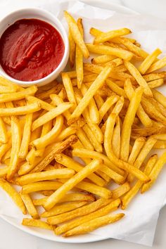 french fries with ketchup on the side and text overlay that says air fryer frozen french fries