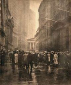 an old black and white photo of people walking in the rain on a city street