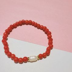 Coral Bangle Bracelet As Gift, Adjustable Coral Bracelets As A Gift, Red Everyday Bangle Bracelets, Adjustable Coral Stretch Bracelet As Gift, Adjustable Coral Stretch Bracelet, Red Bangle Bracelet For Everyday, Everyday Red Bangle Bracelets, Coral Stretch Bracelet With Round Beads, Coral Stretch Bracelet With Round Beads As Gift