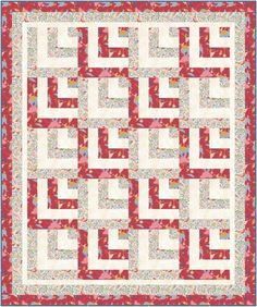 a red and white quilt with an intricate design