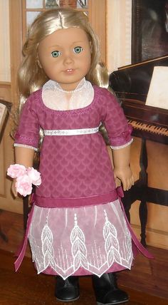 a doll is standing in front of a piano