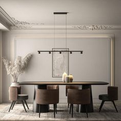 an elegant dining room with black chairs and a round wooden table surrounded by white walls