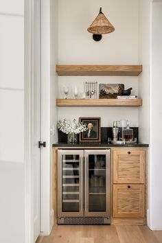 a kitchen with open shelving and wooden cabinets