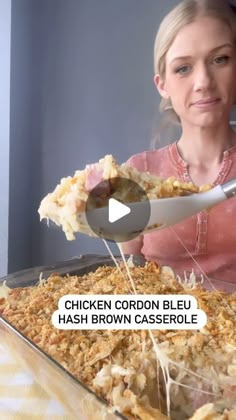 a woman is eating chicken cordon bleu hash brown casserole with a spoon