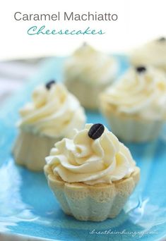 some cupcakes are sitting on a blue plate