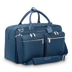 Designed to fit perfectly in the overhead bin, this carry-on is as functional as it is elegant. Its two exterior compartments are ideal for your travel essentials—while its main compartment is roomy enough for your must-have outfits and backups, too. Fits up to a 15" laptop. SKU: P251-5 Laptop Compartment Slip-Through Back Panel INTERIOR FEATURES Cavernous main compartment holds an assortment of items both large and small. Internal organizer with two slip pockets, business card slip pockets, and pen loops. Keep your water bottle secure but accessible with an interior pocket. Tech section in main compartment includes an integrated padded laptop sleeve protects most 15" computers and slip pocket for a tablet. Fabric lining is durable and soft in a contrasting color that makes finding content Modern Bags With Pockets For On-the-go, Travel Tote Bags With Functional Pockets, Versatile Travel Luggage With Zipper Pocket, Functional Pockets Tote Bag For Travel, Functional Tote Bags For Travel, Functional Travel Bag With Zipper Pocket For Business Trips, Elegant Large Capacity Laptop Bag For Travel, Functional Rectangular Duffle Bag For On-the-go, Versatile Luggage With Zipper Pocket For Trips