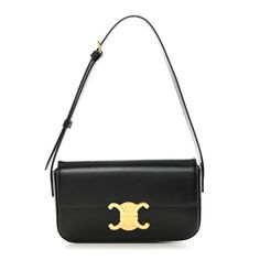 This is an authentic CELINE Shiny Calfskin Triomphe Shoulder Bag in Black. This chic shoulder bag is crafted of smooth calfskin leather in black. The bag features an adjustable leather shoulder strap with gold hardware, and a matching gold press lock on the crossover flap that opens to a partitioned black leather interior with a flat pocket. Celine Triomphe Bag, Triomphe Shoulder Bag, Summer/fall Outfits, Dream Items, Celine Shoulder Bag, Bags 2024, Celine Bags, Shoulder Bag Black, Celine Bag