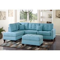 a living room with a blue couch and ottoman