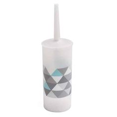 a white cup with a toothbrush in it