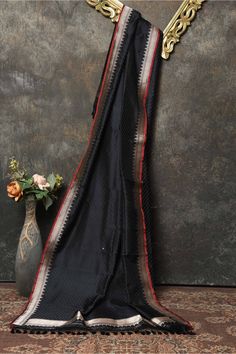 Buy beautiful black Banarasi dupatta online in USA. Add a perfect festive touch to your Indian suits with exquisite Banarasi dupattas, phulkari dupattas, embroidered dupatta, bandhej dupatta, printed dupatta from Pure Elegance Indian saree store in USA.-full view Black Art Silk Traditional Wear With Sheer Dupatta, Black Anarkali Unstitched Chanderi Suit, Black Chanderi Anarkali Unstitched Suit, Black Anarkali Salwar Kameez In Art Silk, Unstitched Black Art Silk Saree, Black Raw Silk Traditional Wear With Zari Work, Semi-stitched Black Art Silk Salwar Kameez, Black Raw Silk Dupatta In Traditional Drape, Black Raw Silk Saree With Cutdana