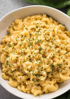 a white bowl filled with macaroni and cheese