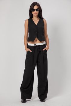 "WIDE-LEG PANTS WITH DUAL WAISTBAND Elevate your style with these high-waisted wide-leg trousers featuring a unique adjustable elasticated double waistband complemented by a chic drawstring and contrasting fabric accents. The ensemble is completed with practical front pockets, adding both functionality and flair. Embrace a fashion-forward look with the distinctive wide-leg design, perfect for making a bold statement wherever you go. SIZE & FIT: Lily is 5'67\" ( 173 cm ) tall, wearing size S COMP Double Waistband Pants Outfit, Double Waistband Pants, Workwear Harem Pants With Elastic Waistband, Fitted Ankle-length Harem Pants For Work, High-waisted Harem Pants With Pockets For Work, Loosely Fitted High-waisted Parachute Pants For Workwear, Edgy Wide-leg Pants With Multiple Pockets, Fitted Harem Pants With Pockets For Work, Fitted High-waisted Harem Pants For Work