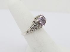 Vintage Sterling Silver Natural Amethyst Filigree Ring ...Marked 925...Total of weights 3.1grams...Size 8...Measure of Face 9.5MM...It's in very good condition. Fine Jewelry Lavender Hallmarked Rings, Classic Lavender Rings For Anniversary, Classic Lavender Ring For Anniversary, Sterling Silver Filigree Rings In Purple, Purple Sterling Silver Filigree Rings, Classic Filigree Amethyst Rings, Filigree Ring, Multi Stone Ring, Multi Stone