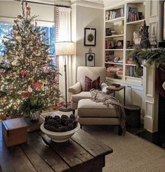 a living room with a christmas tree in the corner