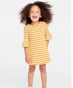 GAP OLD NAVY French-Terry Ruffle-Sleeve Shift Dress  Yellow stripe: Round neck. 3/4-length, ruffled sleeves. Button closure with keyhole cutout at nape. Soft, cozy French terry. Stripes all-over. 52% cotton, 48% Polyester Machine wash cold, tumble dry low. Yellow Girl, Toddler Designer Clothes, Old Navy Toddler Girl, School Dance Dresses, Princess Fashion, Summer Capsule, Spring Capsule Wardrobe, Toddler Girl Style, Dress Yellow