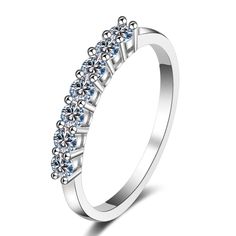 a white gold ring with blue stones on the sides and four rows of diamonds in the middle