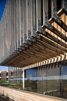 the outside of a building with wooden slats on it