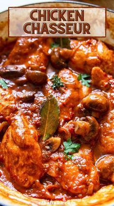 chicken chasseur with mushrooms and parsley in a pan on a table top