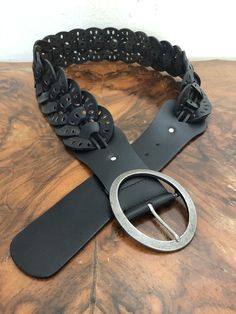 "Old Navy black leather cut out belt, large Black woven leather belt with a cool large buckle PLEASE SEE MEASUREMENTS: Size: 35\"- 40\" Width: 3\" Excellent condition DA923DN Old Navy black leather cut out belt, large" Black Leather Belt With Buckle Closure, Black Leather Festival Belts, Black Leather Belts For Festivals, Black Belt With Removable Feature For Festivals, Red Tapestry, Wide Leather Belt, Leather Sling Bag, Leather Fanny Pack, Leather Cuts