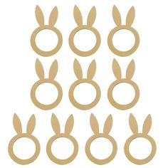 twelve pairs of wooden rings with bunny ears on them