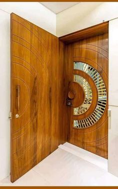 an open wooden door with circular designs on it