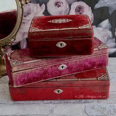 three red boxes sitting on top of a table