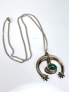 "Vintage Artisan Malachite & Sterling Silver Necklace -Appears to be handmade, artisan design -Abstract, modern design with a single malachite stone, very fine sawtooth bezel set -Pendant is unmarked, tests for Sterling silver -Pendant measures about 1.1\" x 1.1\" with a depth of .4\" -Malachite stone measures 8.5mm x 6mm oval shaped -Comes with a Sterling silver cable chain, 18\", marked Sterling on the clasp -In very nice vintage condition with patina to the silver consistent with age and use. Modern Green Malachite Jewelry, Modern Green Necklace With Polished Finish, Green Pendant Necklace With Inlay, Modernist Green Jewelry For Gifts, Modern Green Collectible Jewelry, Handmade Modernist Jewelry For Collectors, Artisan Malachite Jewelry For Jewelry Making, Artisan Malachite Pendant Necklace, Artisan Malachite Jewelry For Crafting