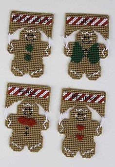 four christmas ornament shaped like teddy bears with candy canes on their backs