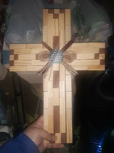 a cross made out of wood with a metal center