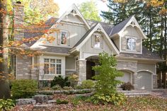 a house in the fall with leaves on the ground