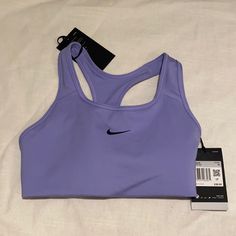 Perfect For Medium Impact Activities Removable 1-Piece Pad Lets You Adjust Your Shape And Support Nike Solid Color Sports Bra, Nike Solid Sports Bra For Sports, Nike Purple Activewear For Gym, Purple Activewear For Training And Sports Season, Purple Activewear For Training, Nike Sporty Purple Activewear, Nike Purple Sporty Activewear, Sporty Purple Nike Activewear, Sporty Nike Activewear In Purple