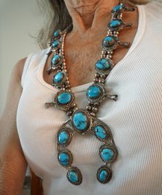 EXTINCT MINE SINCE THE 1970S. HUGE CEREMONIAL BISBEE BLUE TURQUOISE SQUASH BLOSSOM STERLING SILVER NECKLACE; 25.75"L OLD PAWN; HIGH TO GEM GRADE SEVENTEEN  DEEP BLUE BISBEE TURQUOISE WITH MATRIX 134GRTW; and BISBEE TURQUOISE RING SZ10; 29.5GRTW;  BOTH PIECES WITH FABULOUSLY LARGE STONES; BISBEE AZ MINE OPENED 1870 PERMANENTLY CLOSED IN 1975.  This listing is for the large squash blossom necklace only.  The choker necklace shown on a group picture is no longer available.  PERFECT MOTHER'S DAY GIF Southwestern Blue Jewelry For Wedding, Bisbee Az, Mothers Day Gif, Bisbee Turquoise, Turquoise Squash Blossom, Group Picture, Squash Blossom Necklace, Squash Blossom, Silver Work